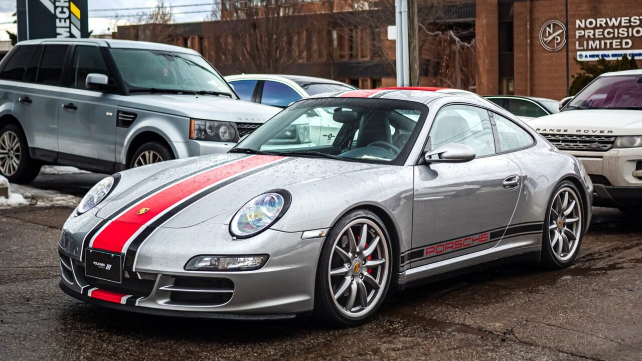 porsche 911 parked in front of mechatronic workshop