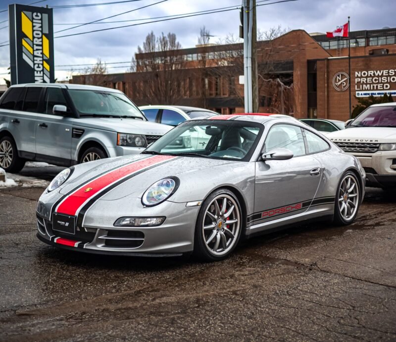 porsche 911 parked in front of mechatronic workshop